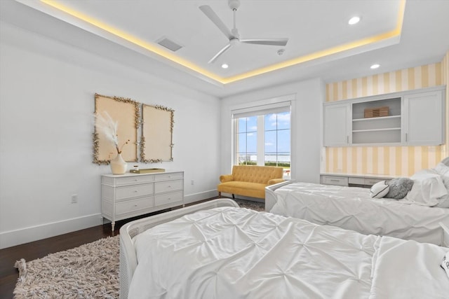 676 Regatta Way, Bradenton, FL 34208 - bedroom featuring a raised ceiling, recessed lighting, dark wood-style flooring, and ceiling fan
