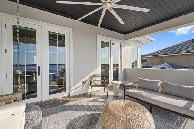 676 Regatta Way, Bradenton, FL 34208 - balcony with french doors, ceiling fan, and an outdoor hangout area