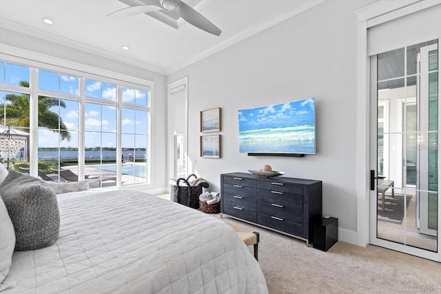 676 Regatta Way, Bradenton, FL 34208 - bedroom featuring access to exterior, light carpet, crown molding, and a ceiling fan