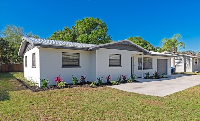 4505 18th Ave W, Bradenton, FL 34209 - ranch-style home featuring a garage, a metal roof, and driveway