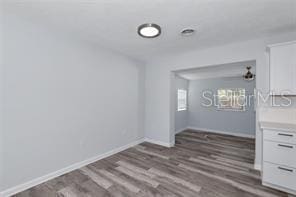 4505 18th Ave W, Bradenton, FL 34209 - spare room featuring wood finished floors and baseboards