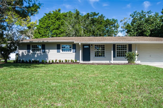 616 59th St NW, Bradenton, FL 34209 - ranch-style house with a garage, a front lawn, driveway, and a shingled roof