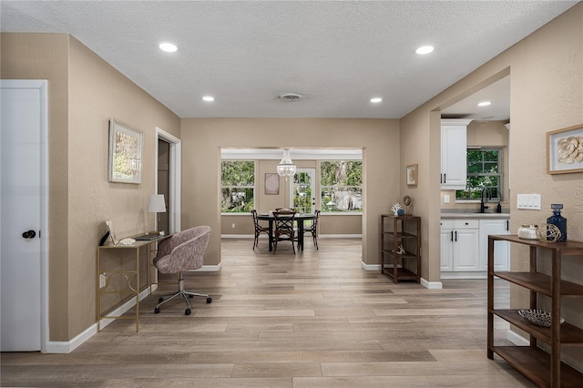 616 59th St NW, Bradenton, FL 34209 - office area with light wood finished floors, a textured ceiling, and recessed lighting