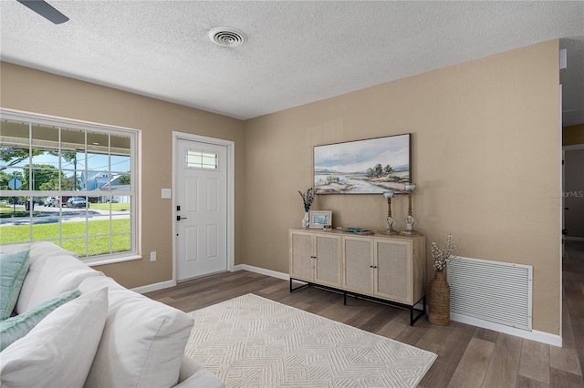 616 59th St NW, Bradenton, FL 34209 - foyer with wood finished floors and a textured ceiling