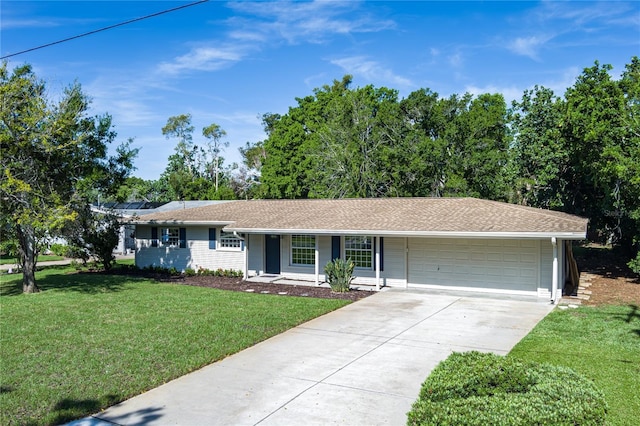 616 59th St NW, Bradenton, FL 34209 - ranch-style house featuring an attached garage, driveway, and a front lawn