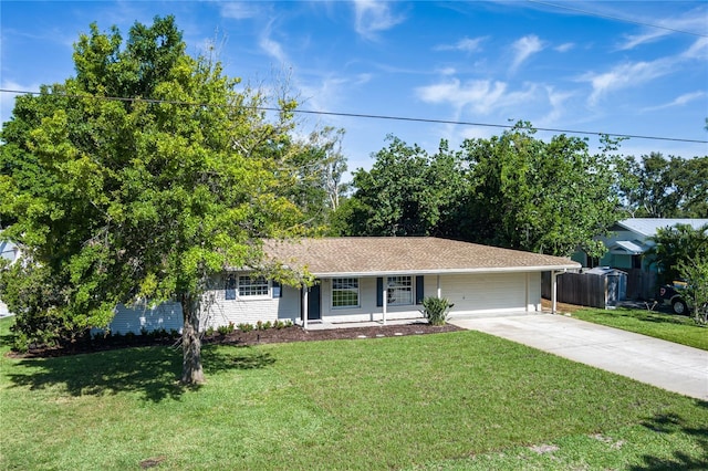 616 59th St NW, Bradenton, FL 34209 - ranch-style home with concrete driveway, a front lawn, and a garage