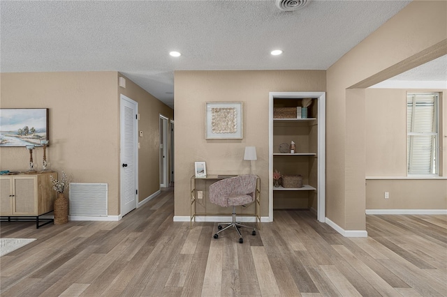 616 59th St NW, Bradenton, FL 34209 - office area with wood finished floors, a textured ceiling, and recessed lighting