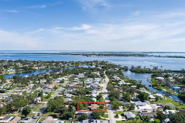 616 59th St NW, Bradenton, FL 34209 - aerial view of residential area with property parcel outlined and a nearby body of water