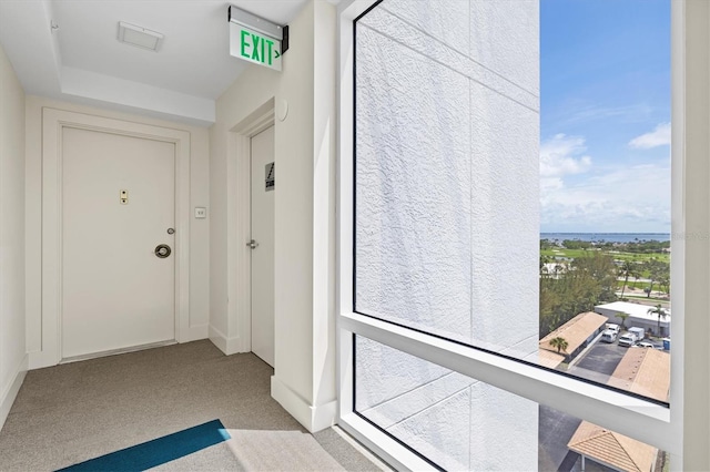 2425 Gulf Of Mexico Dr Unit 10F, Longboat Key, FL 34228 - doorway featuring carpet and baseboards