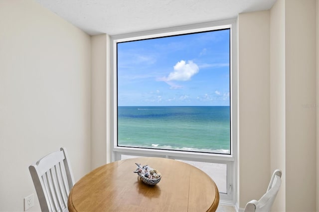2425 Gulf Of Mexico Dr Unit 10F, Longboat Key, FL 34228 - dining room with expansive windows and a textured ceiling