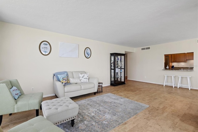 2425 Gulf Of Mexico Dr Unit 10F, Longboat Key, FL 34228 - living area with baseboards