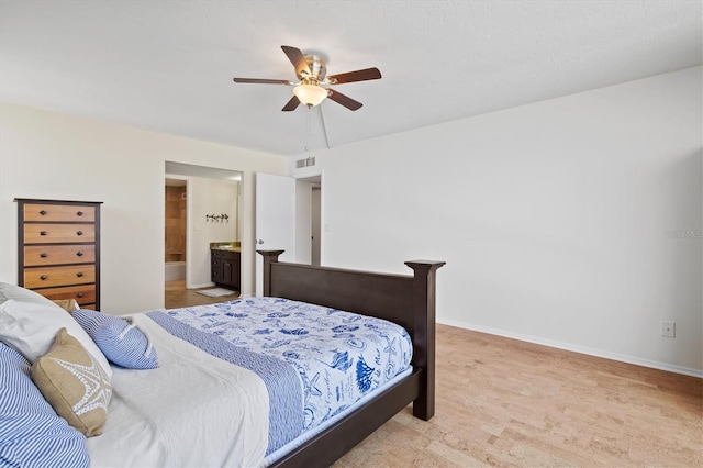 2425 Gulf Of Mexico Dr Unit 10F, Longboat Key, FL 34228 - bedroom with ceiling fan and ensuite bath