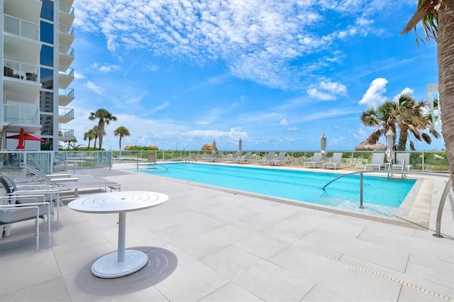 2425 Gulf Of Mexico Dr Unit 10F, Longboat Key, FL 34228 - community pool featuring a patio area