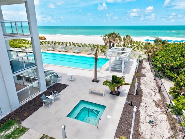 2425 Gulf Of Mexico Dr Unit 10F, Longboat Key, FL 34228 - community pool with a patio, view of water and beach, and a community hot tub