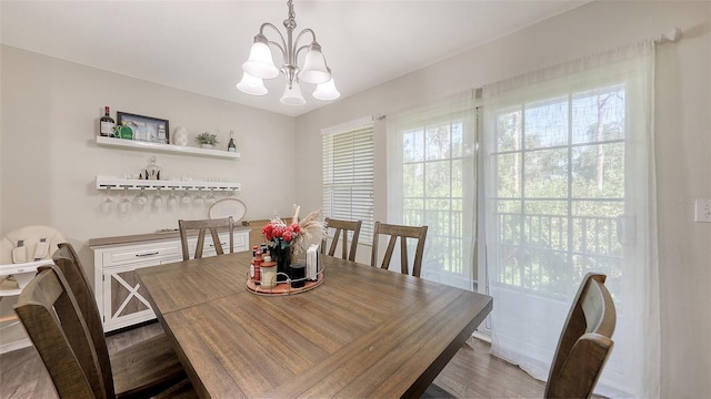 8907 White Sage Loop, Lakewood Ranch, FL 34202 - dining area featuring a chandelier and wood finished floors