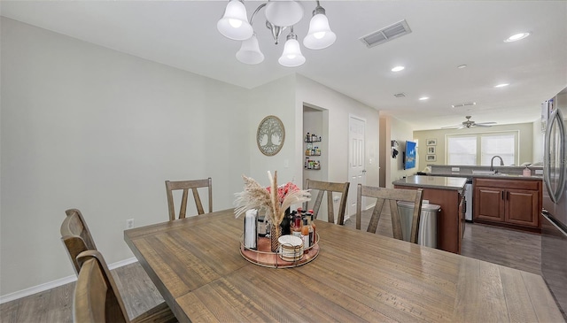 8907 White Sage Loop, Lakewood Ranch, FL 34202 - dining space featuring dark wood-style floors, a chandelier, recessed lighting, and ceiling fan