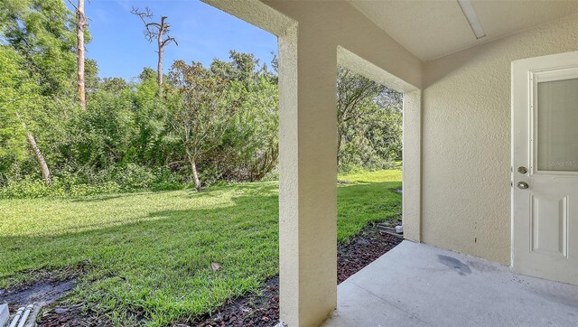 8907 White Sage Loop, Lakewood Ranch, FL 34202 - view of grassy yard with a patio area