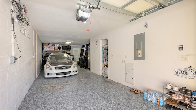 8907 White Sage Loop, Lakewood Ranch, FL 34202 - garage featuring electric panel and a garage door opener