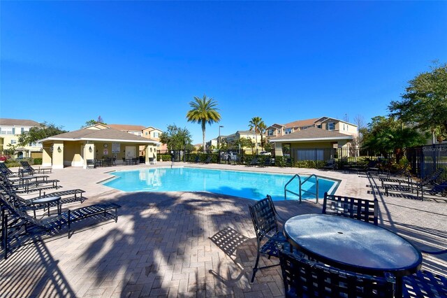 8907 White Sage Loop, Lakewood Ranch, FL 34202 - community pool featuring a patio