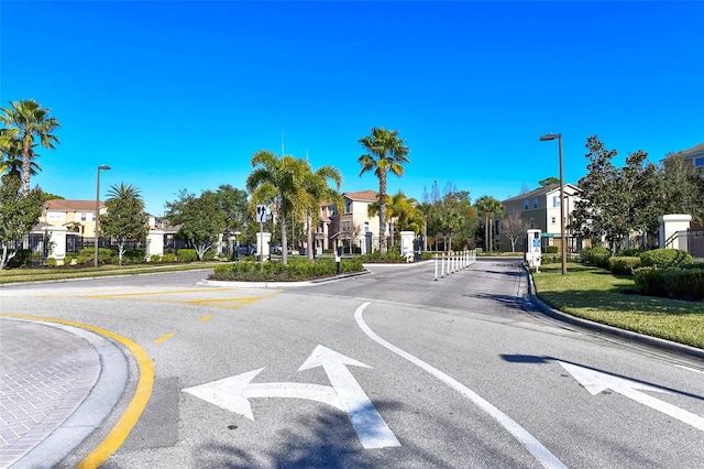 8907 White Sage Loop, Lakewood Ranch, FL 34202 - view of asphalt road featuring street lights, a residential view, and curbs