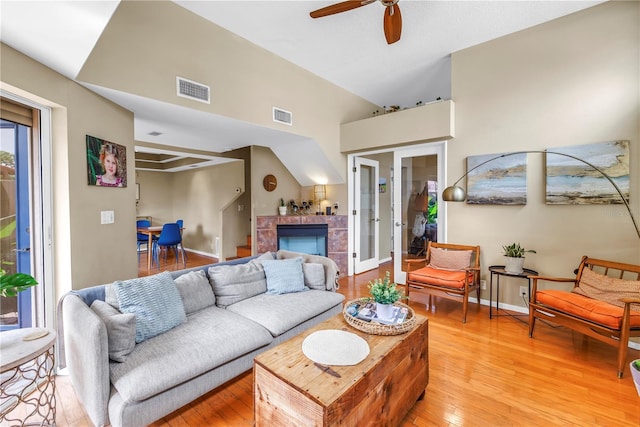 200 Cocoanut Ave Unit 1, Sarasota, FL 34236 - living room featuring ceiling fan, light wood-type flooring, and a fireplace