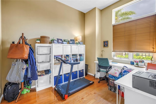 200 Cocoanut Ave Unit 1, Sarasota, FL 34236 - miscellaneous room with light wood-style flooring, an office area, and a high ceiling