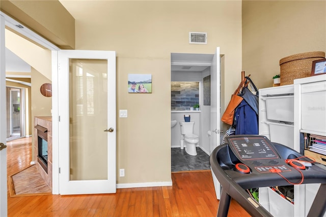 200 Cocoanut Ave Unit 1, Sarasota, FL 34236 - office with hardwood / wood-style flooring and a glass covered fireplace