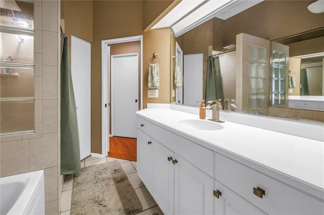200 Cocoanut Ave Unit 1, Sarasota, FL 34236 - full bath with a shower with shower curtain, a bathtub, vanity, and tile patterned floors
