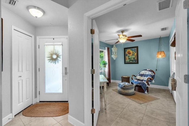 529 Sunset Rd N, Rotonda West, FL 33947 - entrance foyer with light tile patterned flooring and ceiling fan