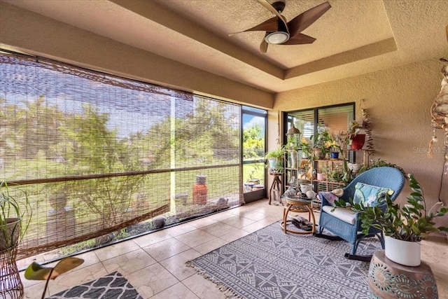 529 Sunset Rd N, Rotonda West, FL 33947 - sunroom with a raised ceiling, tile patterned floors, and a textured wall