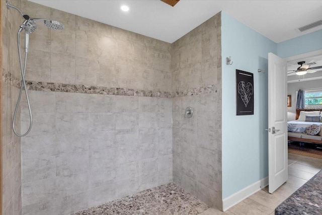 529 Sunset Rd N, Rotonda West, FL 33947 - ensuite bathroom featuring tiled shower and a ceiling fan