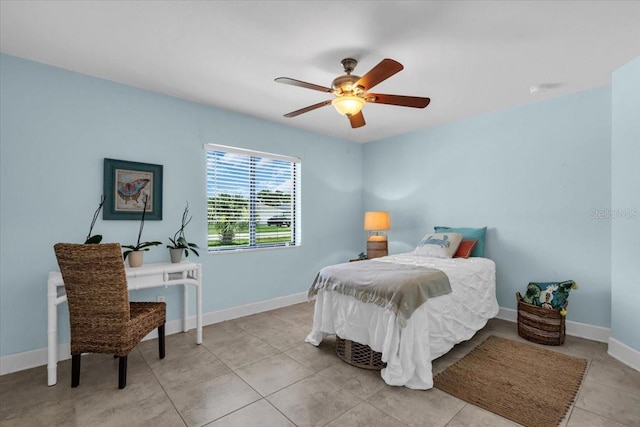 529 Sunset Rd N, Rotonda West, FL 33947 - bedroom with a ceiling fan and light tile patterned floors