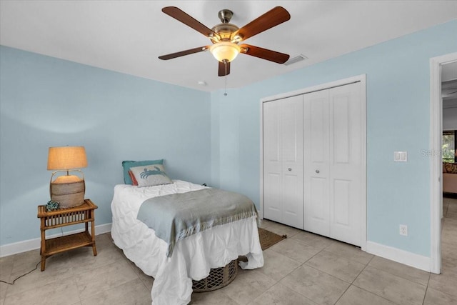 529 Sunset Rd N, Rotonda West, FL 33947 - bedroom featuring a closet, a ceiling fan, and tile patterned flooring