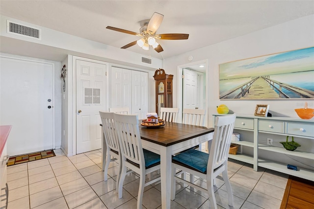 618 Bird Bay Dr S Unit 113, Venice, FL 34285 - dining area with light tile patterned flooring and a ceiling fan
