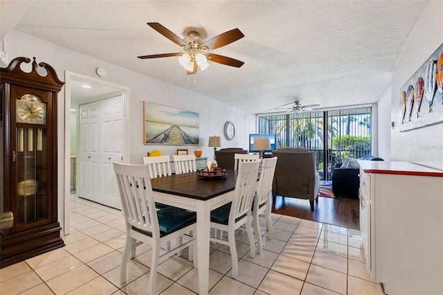 618 Bird Bay Dr S Unit 113, Venice, FL 34285 - dining room featuring light tile patterned flooring and ceiling fan