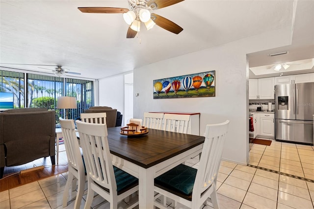 618 Bird Bay Dr S Unit 113, Venice, FL 34285 - dining room with light tile patterned floors and ceiling fan