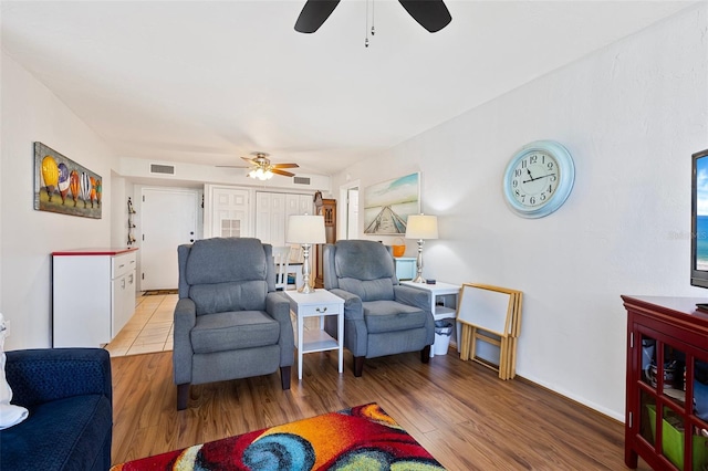 618 Bird Bay Dr S Unit 113, Venice, FL 34285 - living room featuring a ceiling fan and wood finished floors
