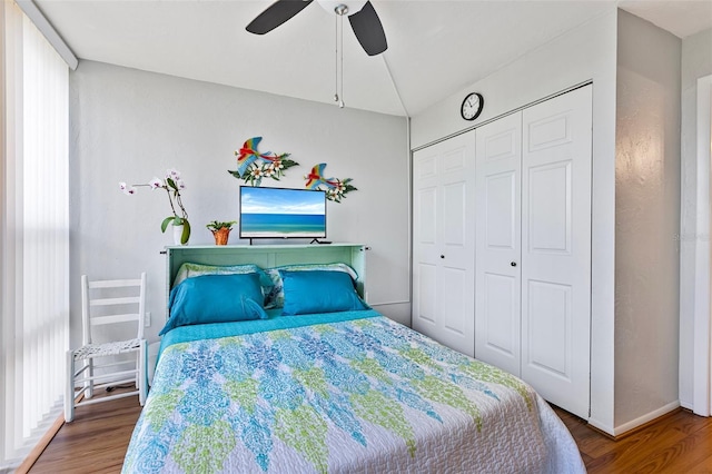 618 Bird Bay Dr S Unit 113, Venice, FL 34285 - bedroom featuring wood finished floors, a closet, and a ceiling fan