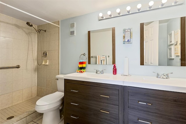 618 Bird Bay Dr S Unit 113, Venice, FL 34285 - full bath featuring double vanity, a tile shower, and tile patterned floors