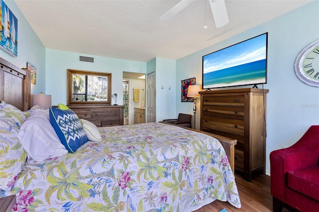 618 Bird Bay Dr S Unit 113, Venice, FL 34285 - bedroom featuring wood finished floors, connected bathroom, and a ceiling fan