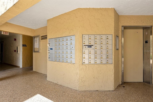618 Bird Bay Dr S Unit 113, Venice, FL 34285 - view of home's community featuring a textured wall, mail area, and a textured ceiling
