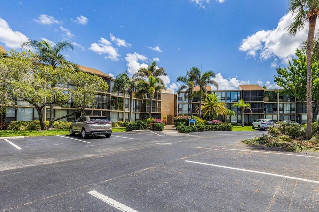 618 Bird Bay Dr S Unit 113, Venice, FL 34285 - view of property with uncovered parking and a residential view