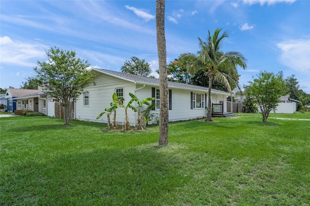 3310 W 9th Ave, Bradenton, FL 34205 - view of side of property with a lawn