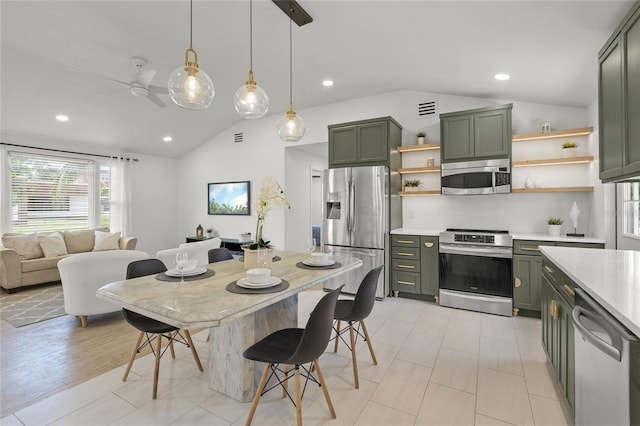 3310 W 9th Ave, Bradenton, FL 34205 - kitchen featuring stainless steel appliances, green cabinets, vaulted ceiling, open shelves, and light countertops