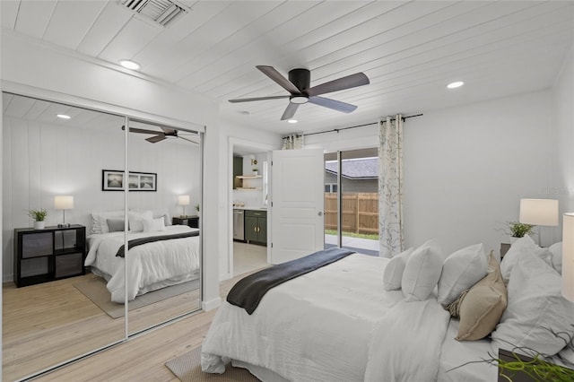 3310 W 9th Ave, Bradenton, FL 34205 - bedroom with access to exterior, light wood-type flooring, ceiling fan, and recessed lighting