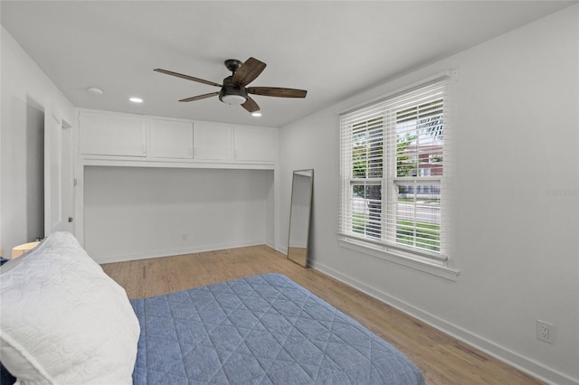3310 W 9th Ave, Bradenton, FL 34205 - bedroom with wood finished floors, a ceiling fan, and recessed lighting