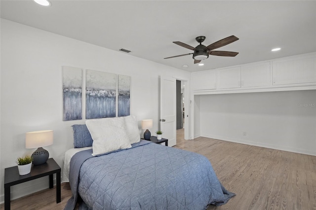 3310 W 9th Ave, Bradenton, FL 34205 - bedroom featuring recessed lighting, wood finished floors, and ceiling fan