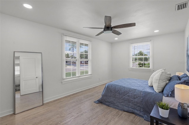 3310 W 9th Ave, Bradenton, FL 34205 - bedroom featuring light wood-type flooring, recessed lighting, and ceiling fan