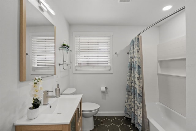 3310 W 9th Ave, Bradenton, FL 34205 - full bath with vanity, tile patterned floors, and shower / bath combination with curtain