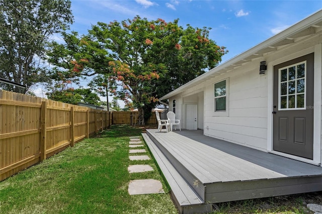 3310 W 9th Ave, Bradenton, FL 34205 - fenced backyard with a wooden deck